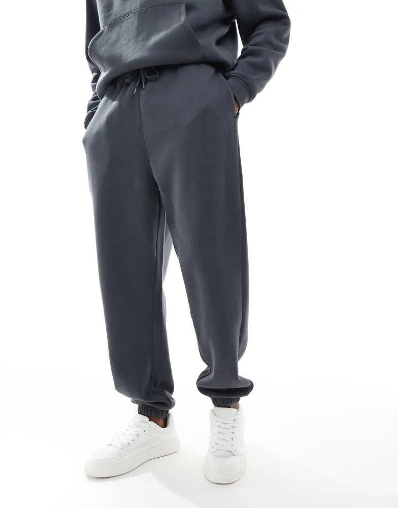 Shop ASOS DESIGN essentials oversized jogger in grey on Sale at