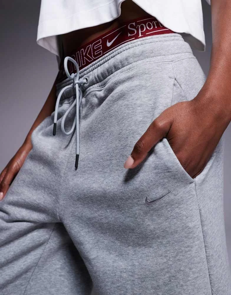 NIKE Nike Phoenix Fleece Gym Life Swoosh wide leg joggers with boxer detail in grey and burgundy 2