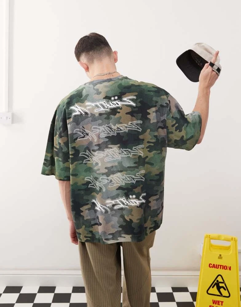 COLLUSION COLLUSION relaxed graffiti graphic t-shirt in camo print 1