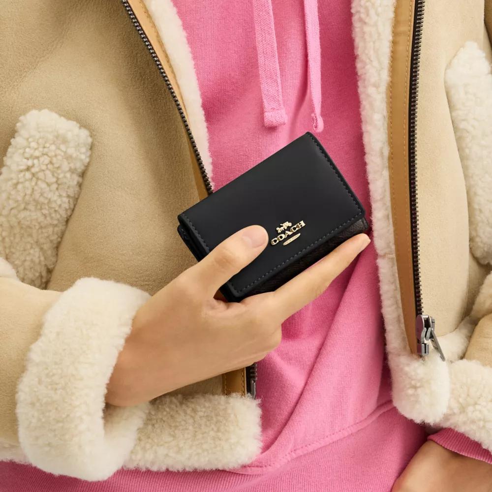 Coach Micro Wallet In Signature Canvas - Wallets - Compare