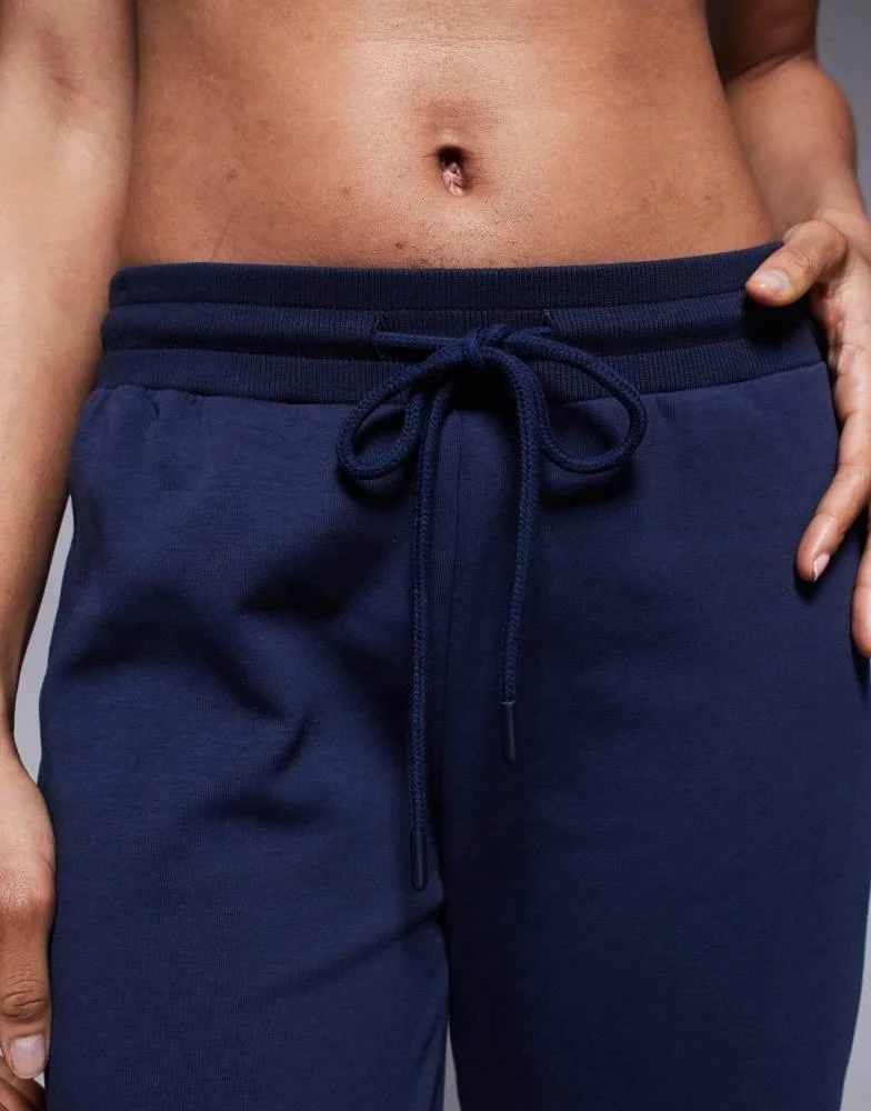 ASOS ASOS DESIGN Tall interlock flared jogger in navy 5