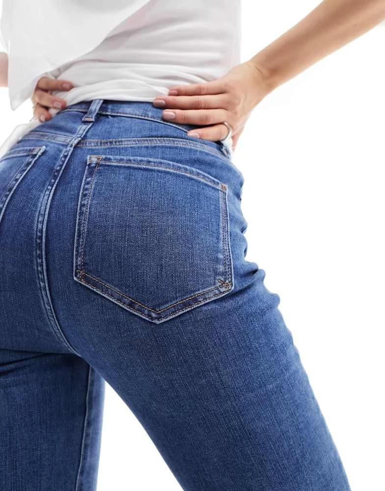 ASOS ASOS DESIGN '70's' sculpting super stretch flared jeans in mid blue 4