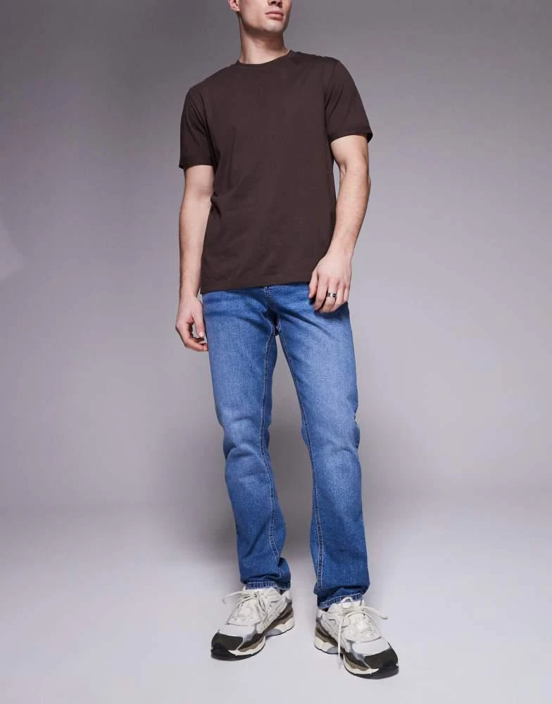 ASOS ASOS DESIGN slim fit jean in mid wash blue 1