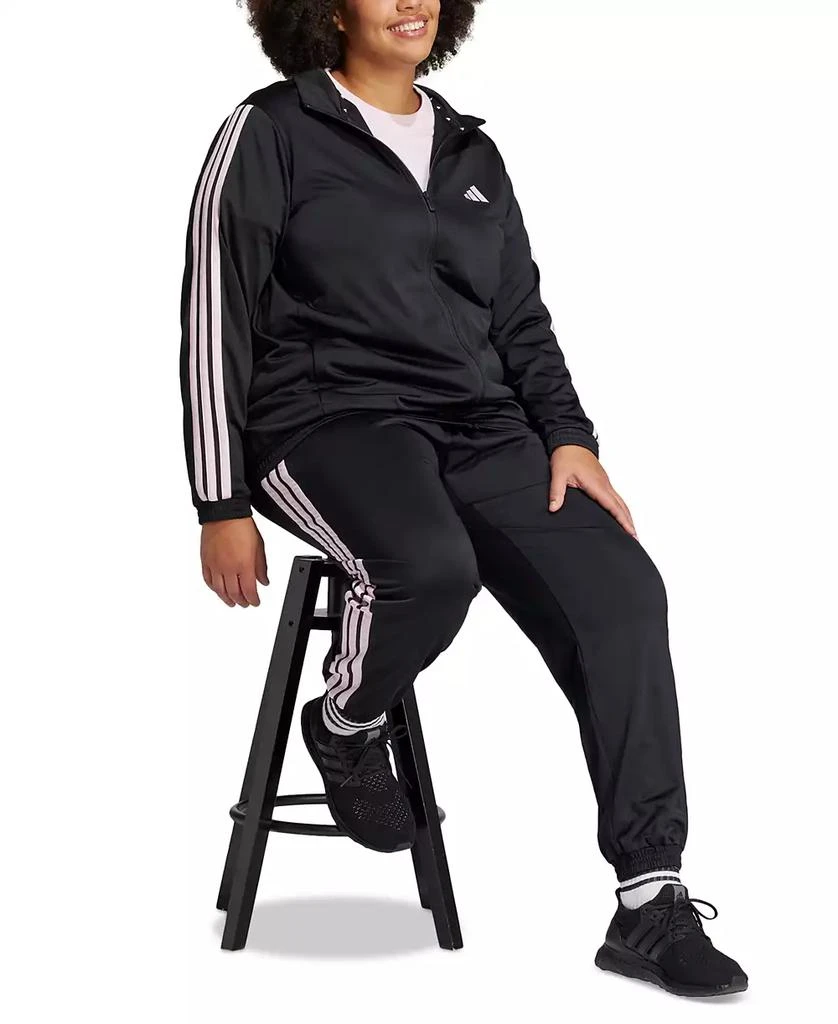 Shop Plus Size Essentials Tricot Three Stripes Track Jacket on