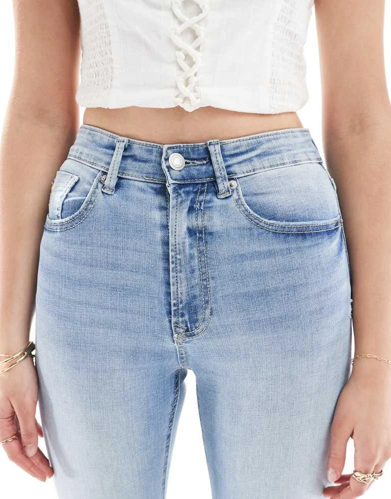 Stradivarius Stradivarius Tall D74 flare slit jean in medium wash 5