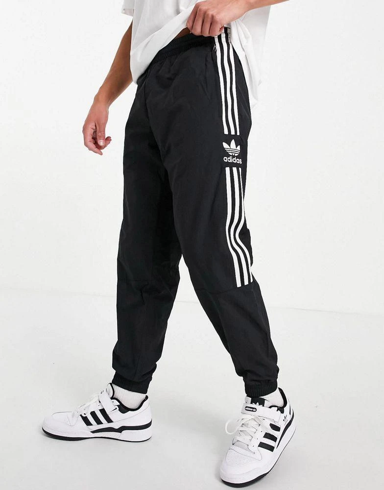 Adidas adidas Originals adicolor lock up joggers in black 1