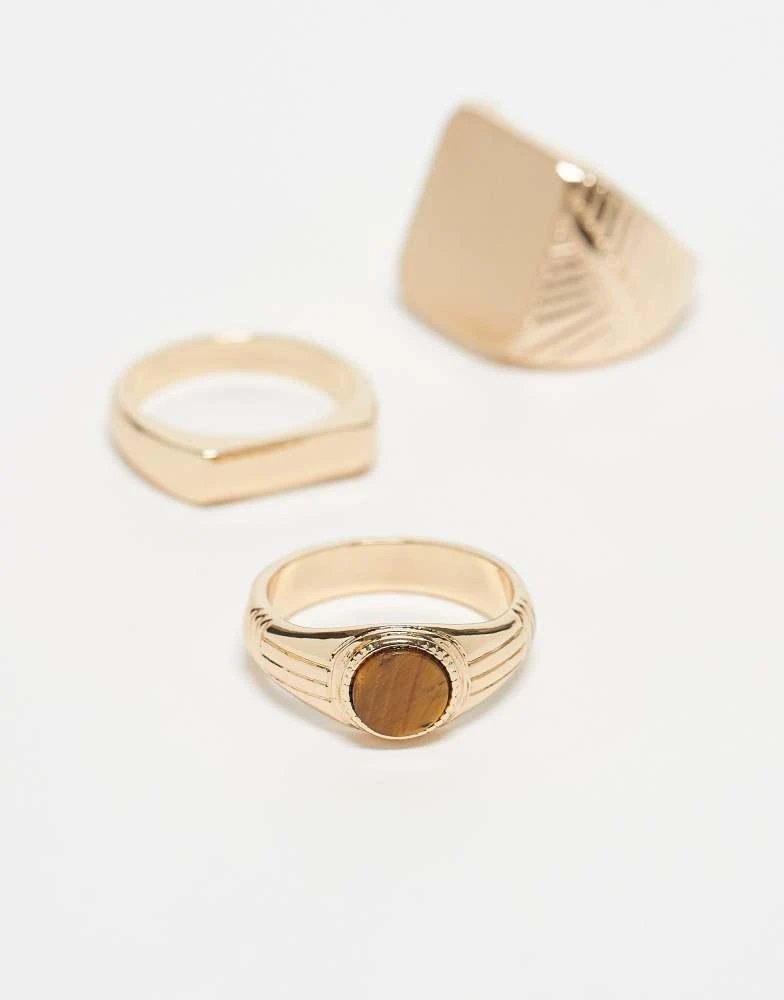 ASOS ASOS DESIGN 3 pack semi-precious tigers eye stone signet ring set in gold 3