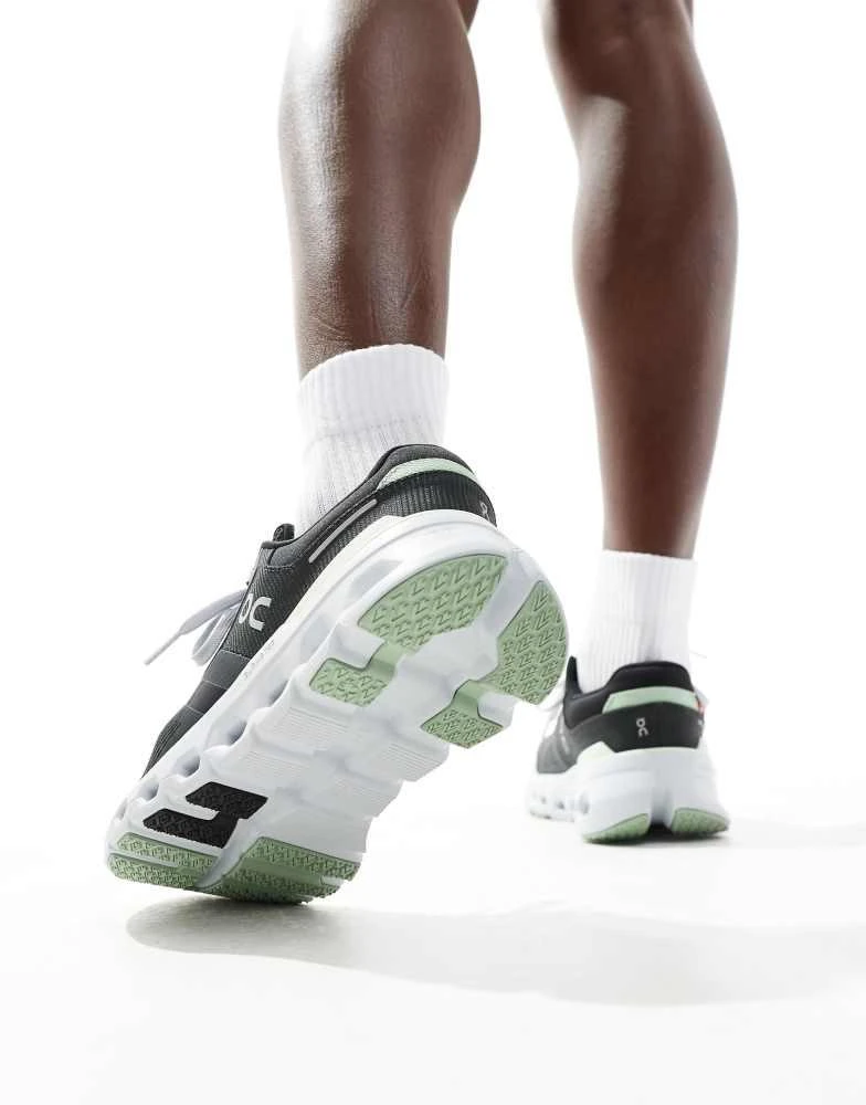 On ON Cloudrunner 2 running trainers in black and lime green 2