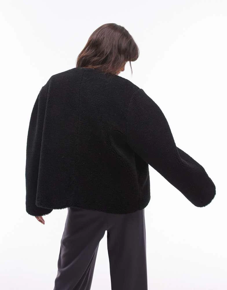 Topshop Topshop toggle short collarless borg coat in black 2