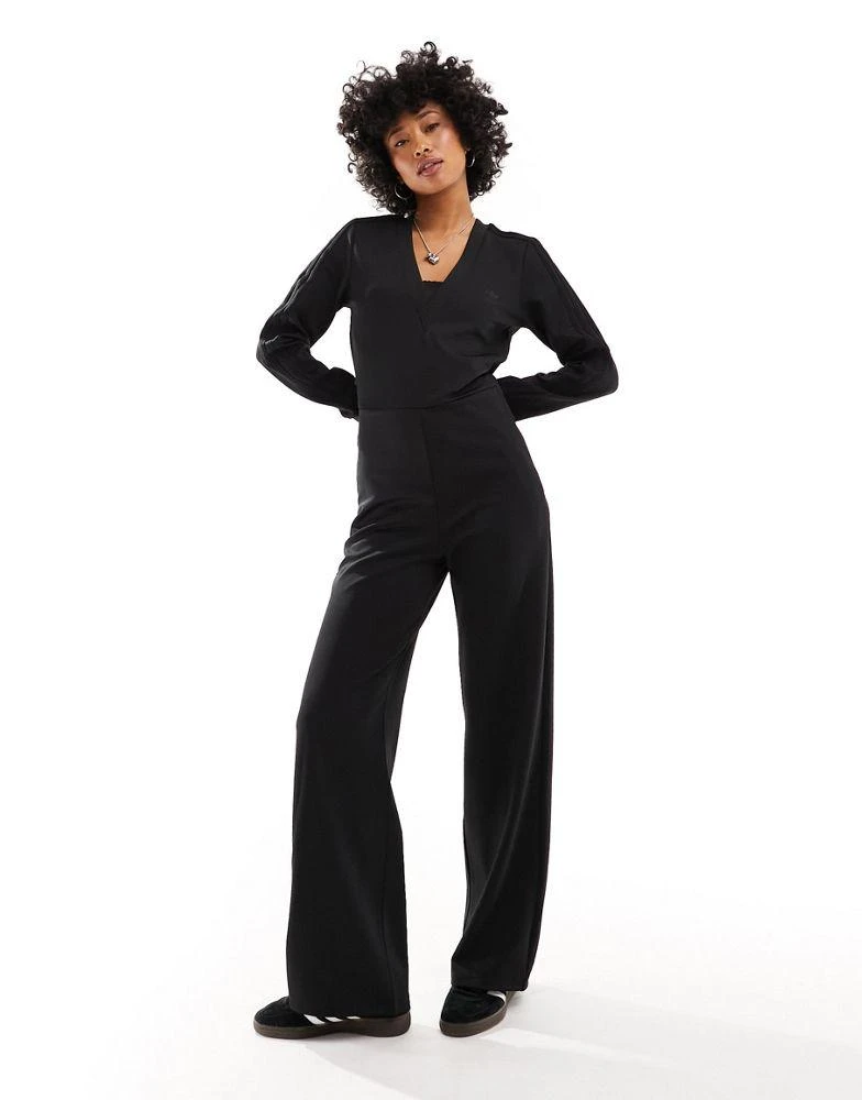 Adidas adidas Originals Dark Varsity jumpsuit in black with lace details 1