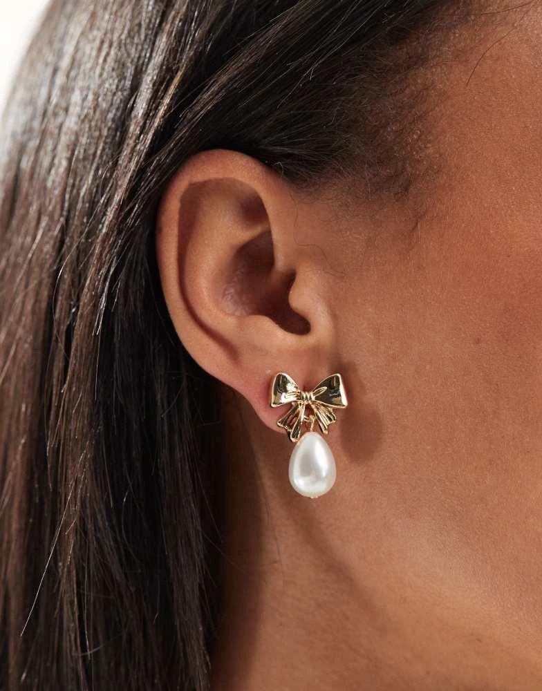 ASOS ASOS DESIGN earrings with mini bow and faux pearl drop design on gold tone 1