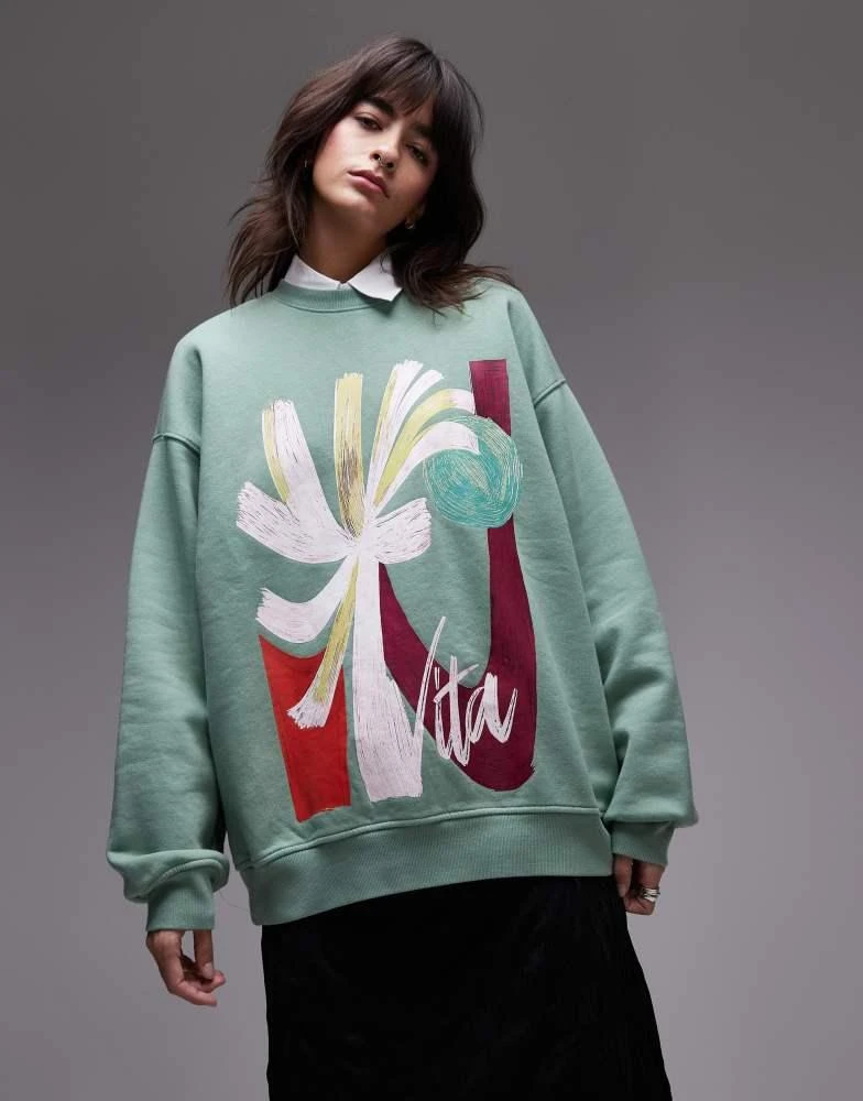 Topshop Topshop oversized washed sweatshirt with abstract graphic in green 1