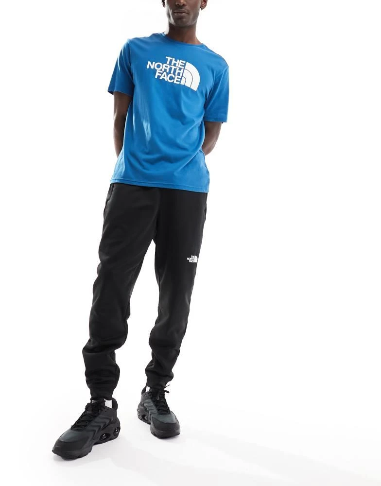 The North Face The North Face Training Reaxion fleece joggers in black 4