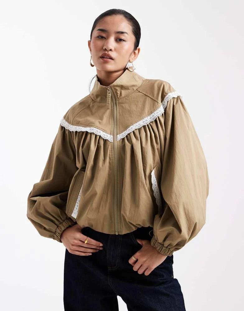 Miss Selfridge Miss Selfridge lace trim funnel neck track jacket in khaki