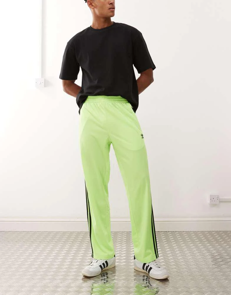 Adidas adidas Originals Firebird track pants in green and black 2