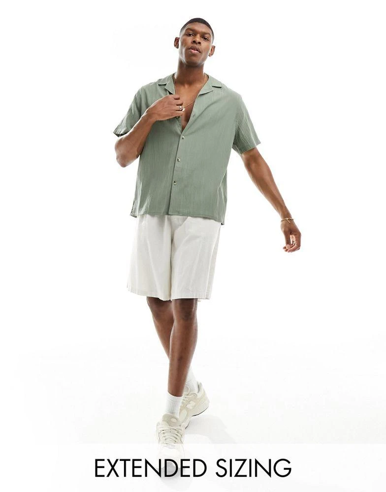 ASOS ASOS DESIGN short sleeve relaxed revere collar crinkle texture shirt in green 1