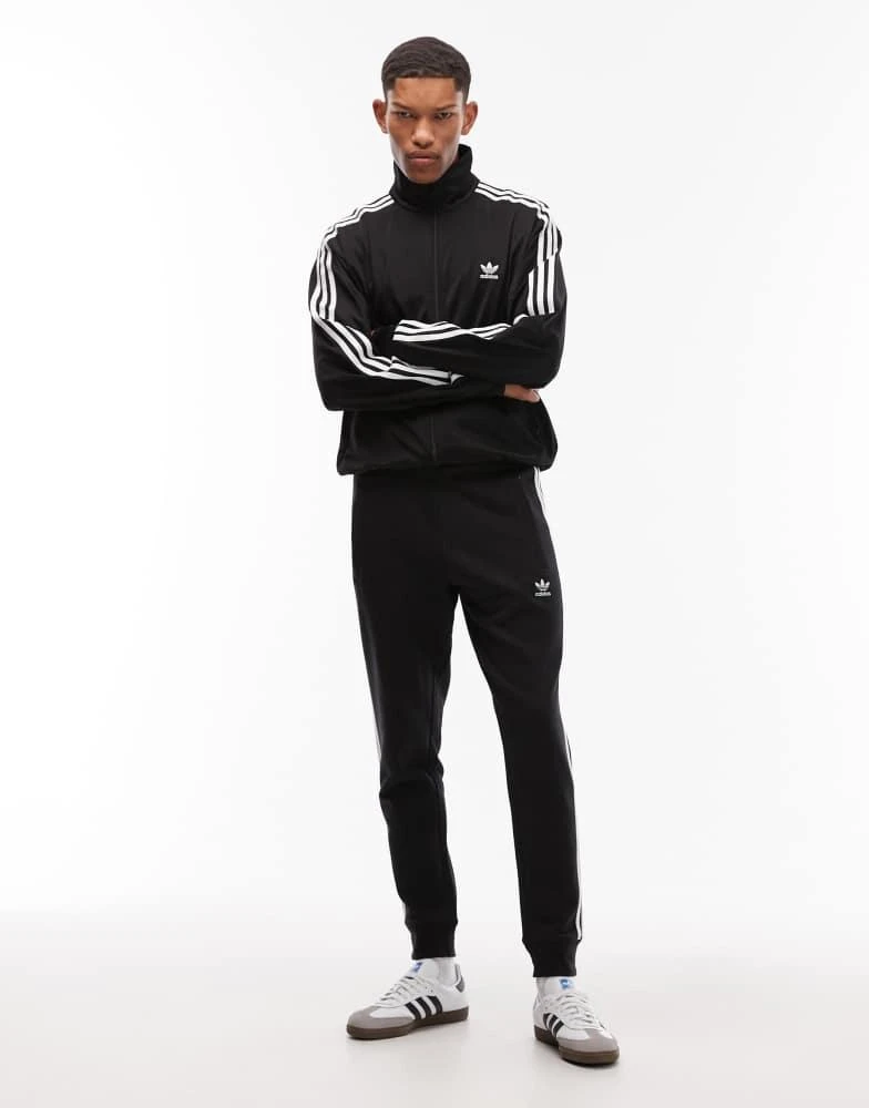 Adidas adidas Originals three stripe joggers in black - Joggers - Free Shipping - BeyondStyle Adidas adidas Originals three stripe joggers in black - Joggers - Free Shipping - BeyondStyle