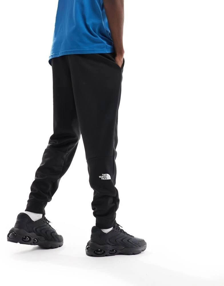 The North Face The North Face Training Reaxion fleece joggers in black 3
