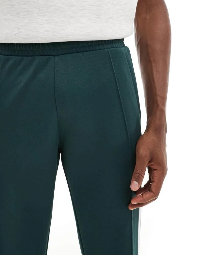 Adidas adidas Originals 70's tracksuit bottoms in mineral green 4