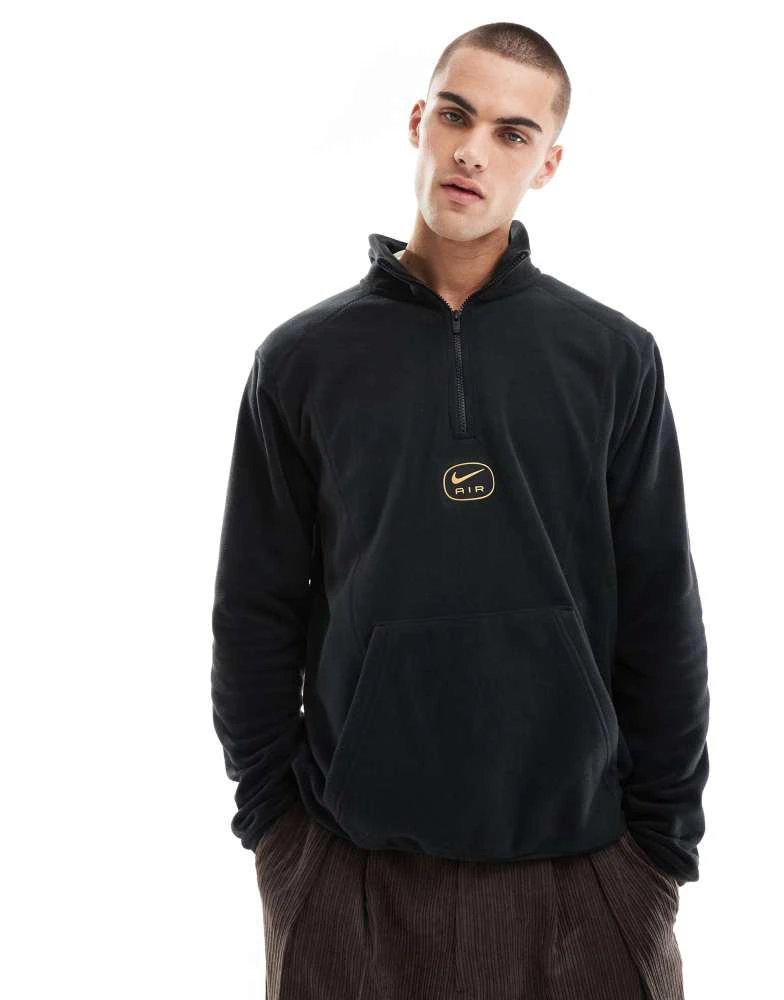 NIKE Nike Swoosh Air polar fleece half zip sweatshirt in black and gold 1