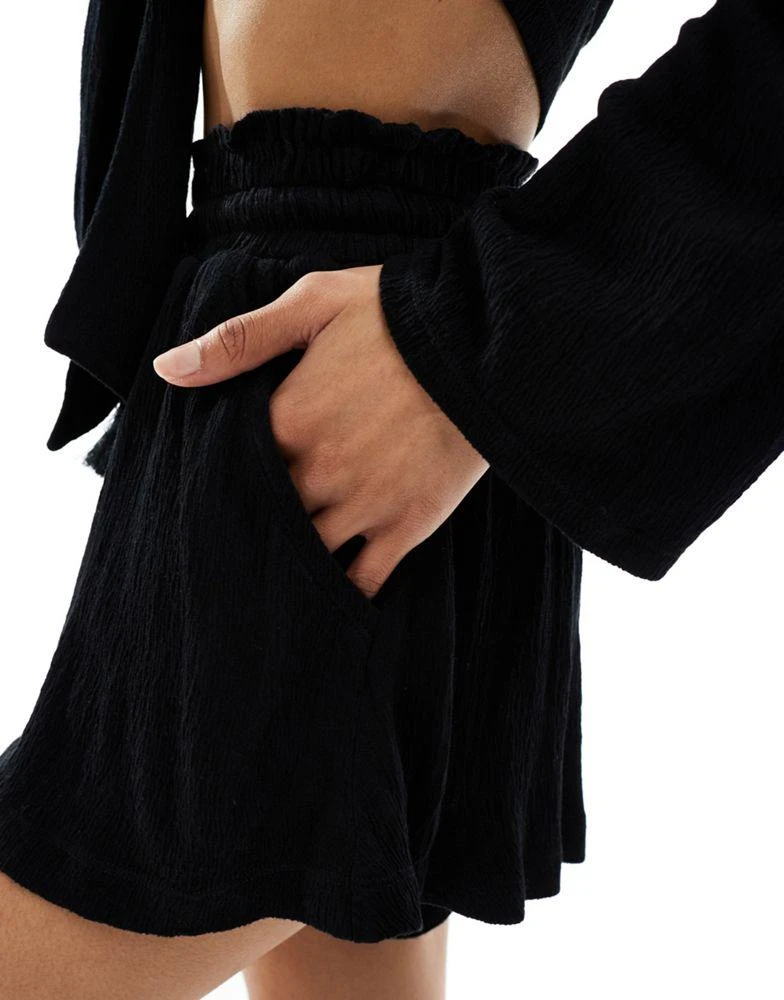 ASOS ASOS DESIGN co-ord textured tassel tie waist flippy shorts in black 2