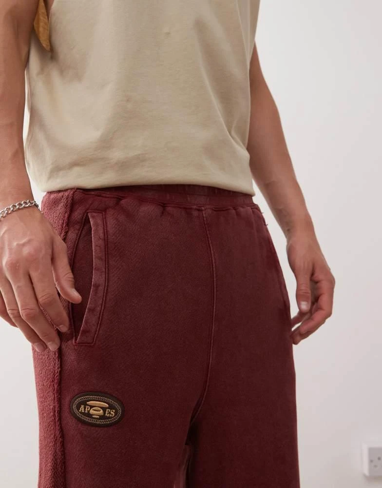 AAPE Aape by A Bathing Ape loose fit heavyweight knitted shorts in dark burgundy with embroidered side stripe 3