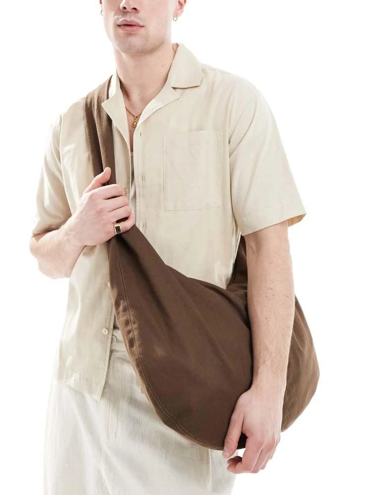 ASOS ASOS DESIGN canvas sling cross body bag in brown 1