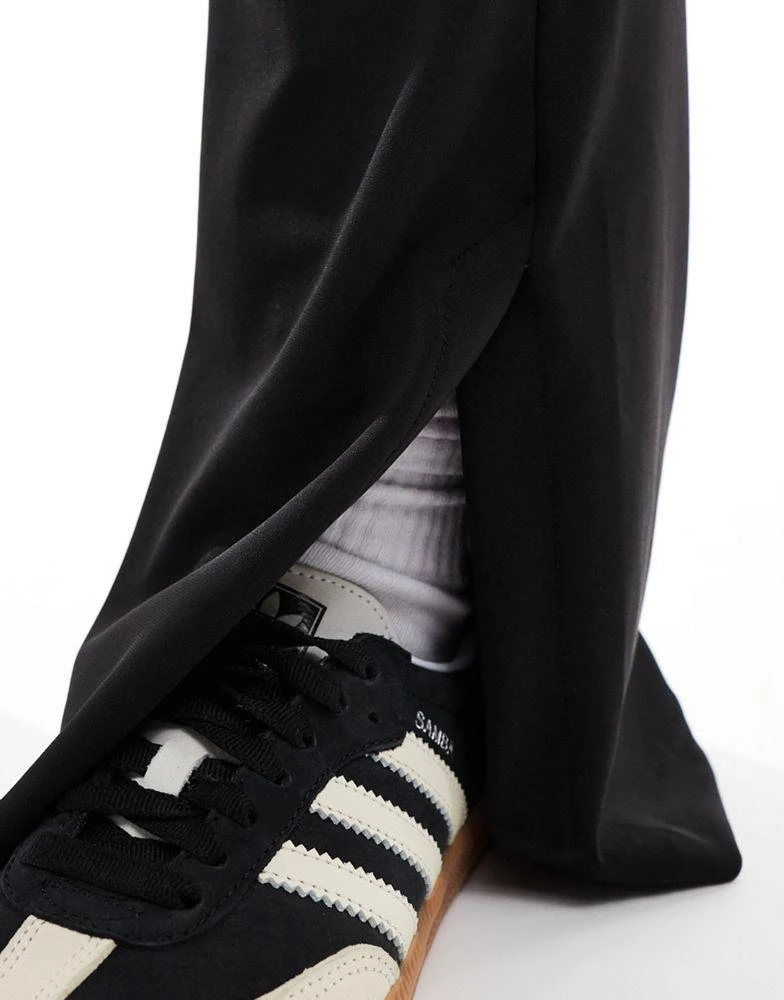 Bershka Bershka high waisted jersey flared trousers in black 3