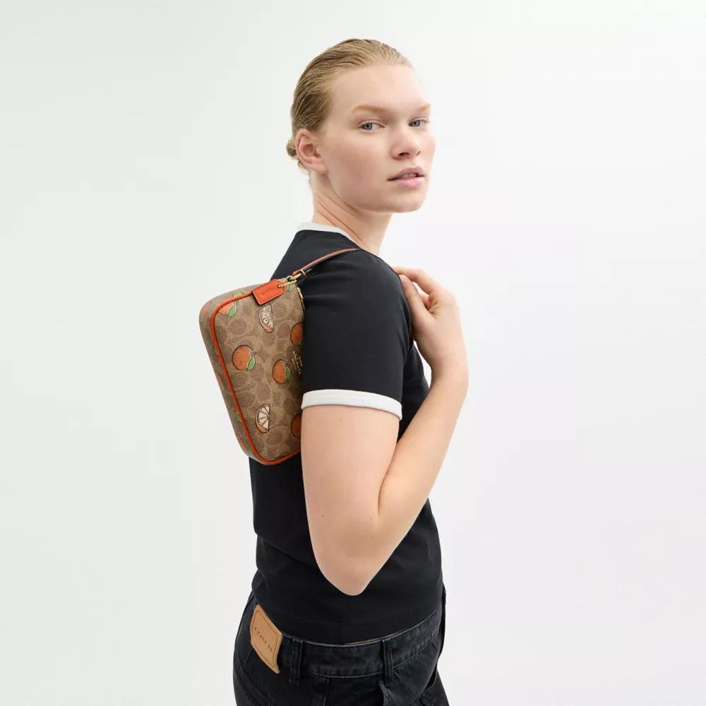 【COACH】Nolita 19 In Signature Canvas/オレンジ Coach Nolita 19 In Signature Canvas With Orange Print