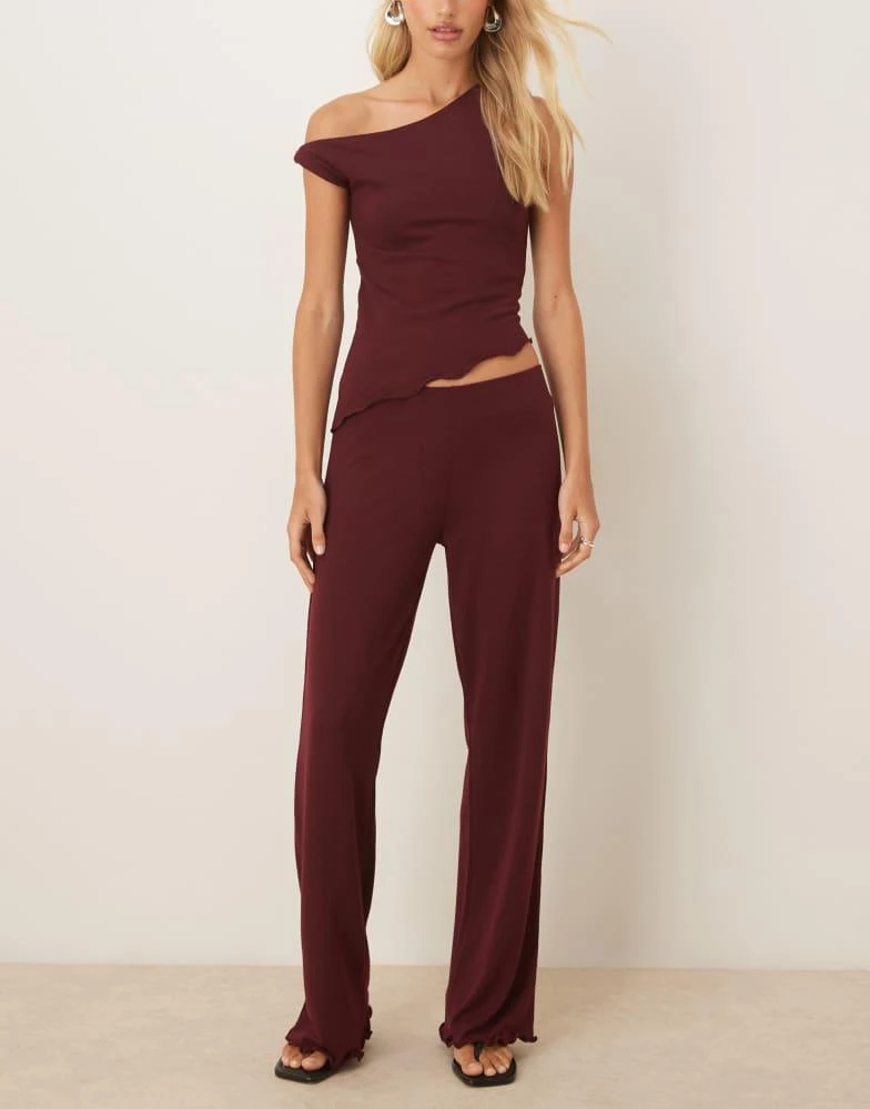 Shop ASOS DESIGN co-ord knit-look straight leg trousers in