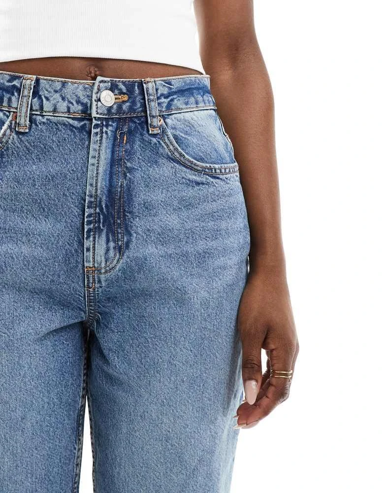 ASOS ASOS DESIGN high rise relaxed mom jeans with rips in mid blue 4