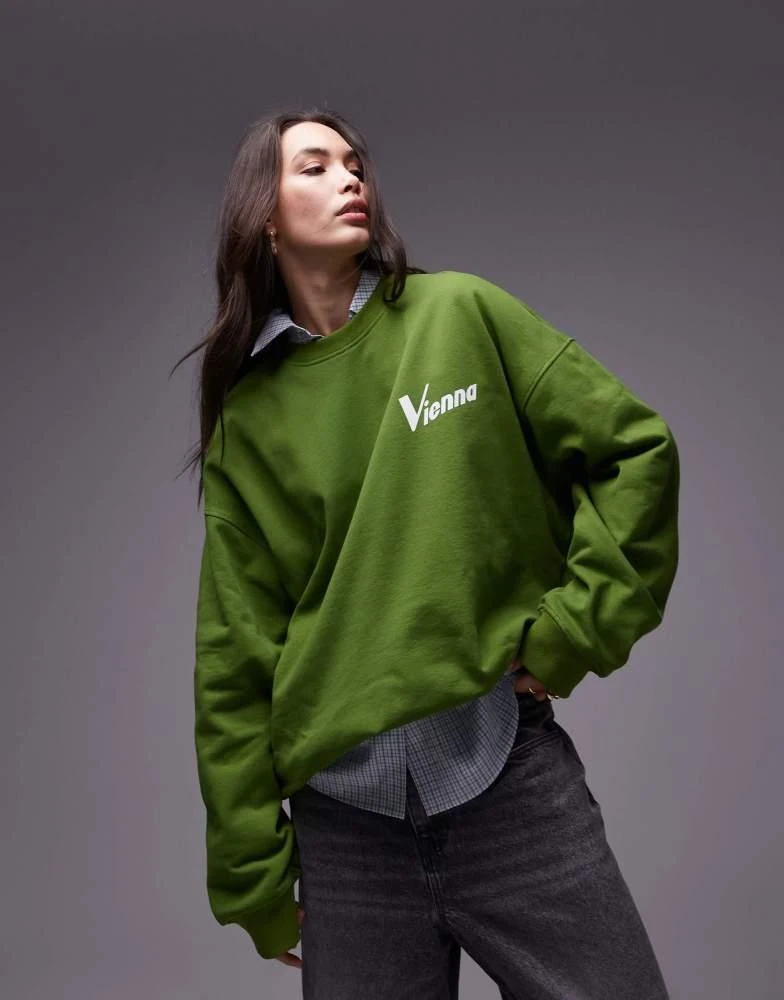 Topshop Topshop slogan Vienna oversized sweatshirt in dark green 1