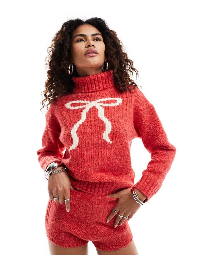 Kiss The Sky Kiss The Sky open back turtleneck jumper with bow in red 1