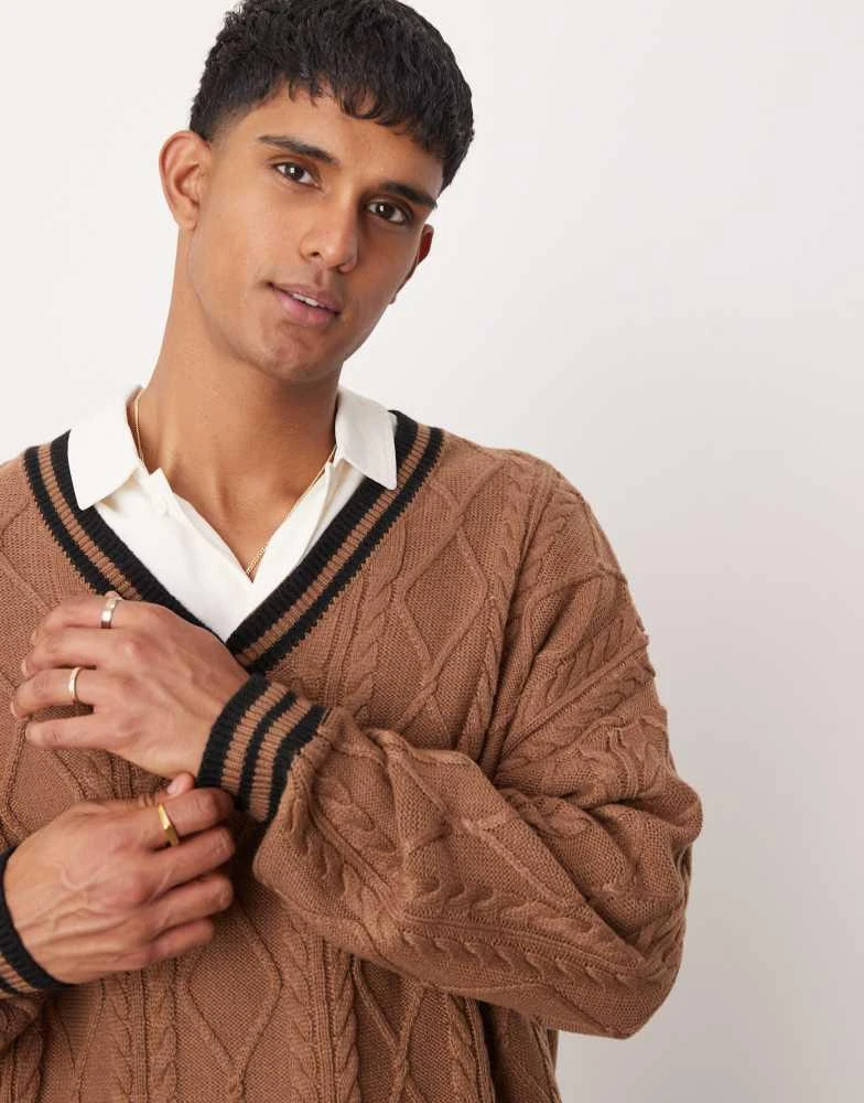 ASOS ASOS DESIGN oversized boxy fit cable knit cricket jumper in brown with black tipping 2