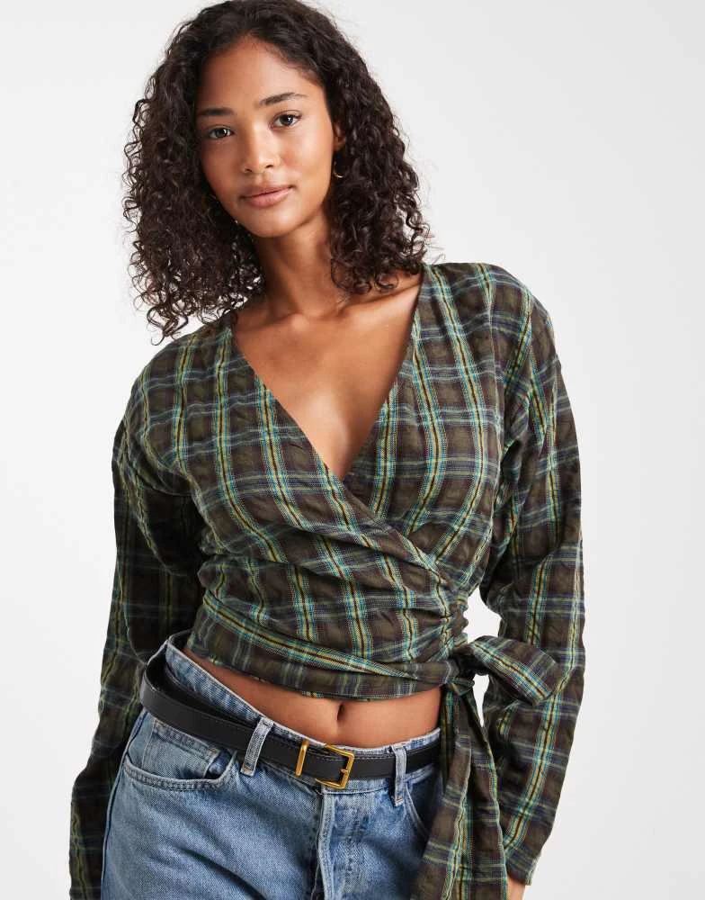Shop ASOS DESIGN long sleeve wrap top in green check on Sale at