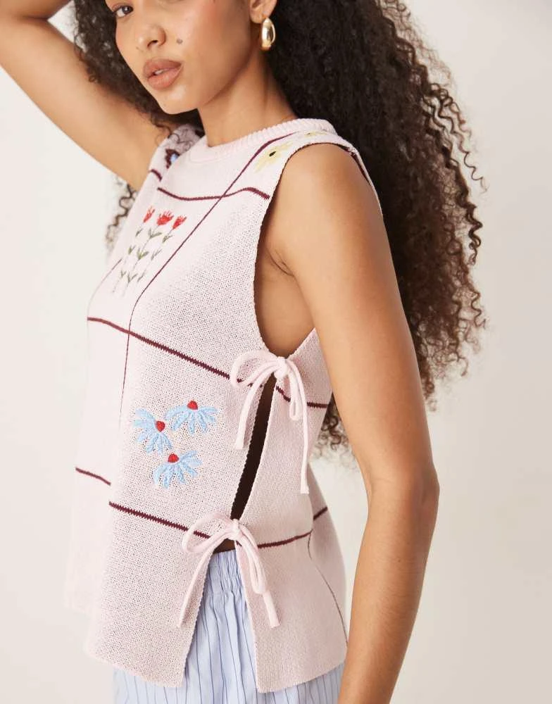 ASOS ASOS DESIGN crew neck knit tabard vest with floral embroidery in pink 2