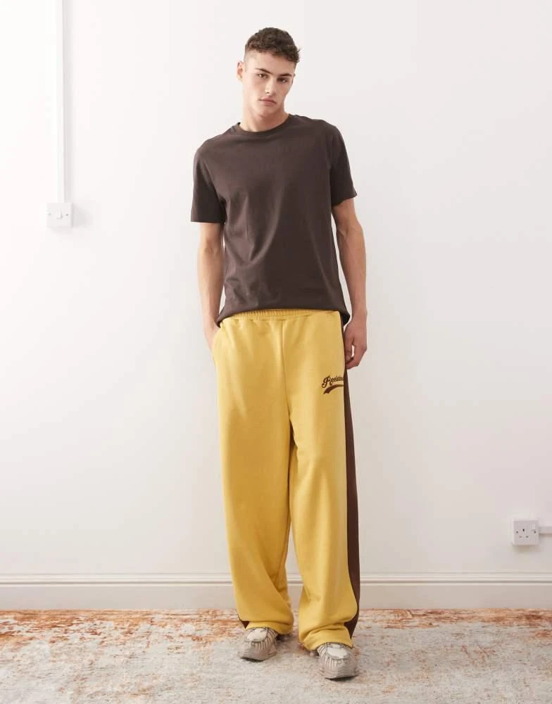 Reclaimed Vintage Reclaimed Vintage heavyweight wide leg jogger in mustard with brown side stripe 1