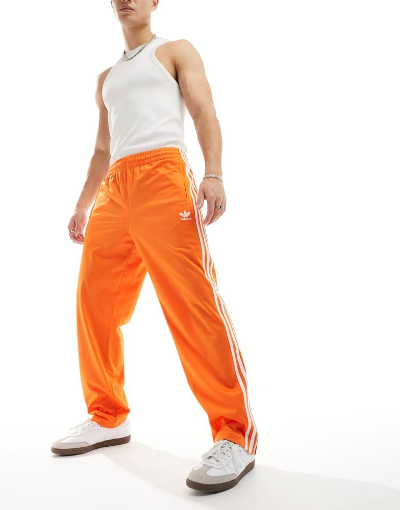 Adidas adidas Originals Firebird track pants in orange