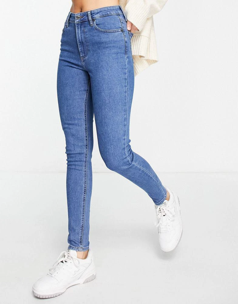 ASOS ASOS DESIGN skinny jeans in mid blue 1