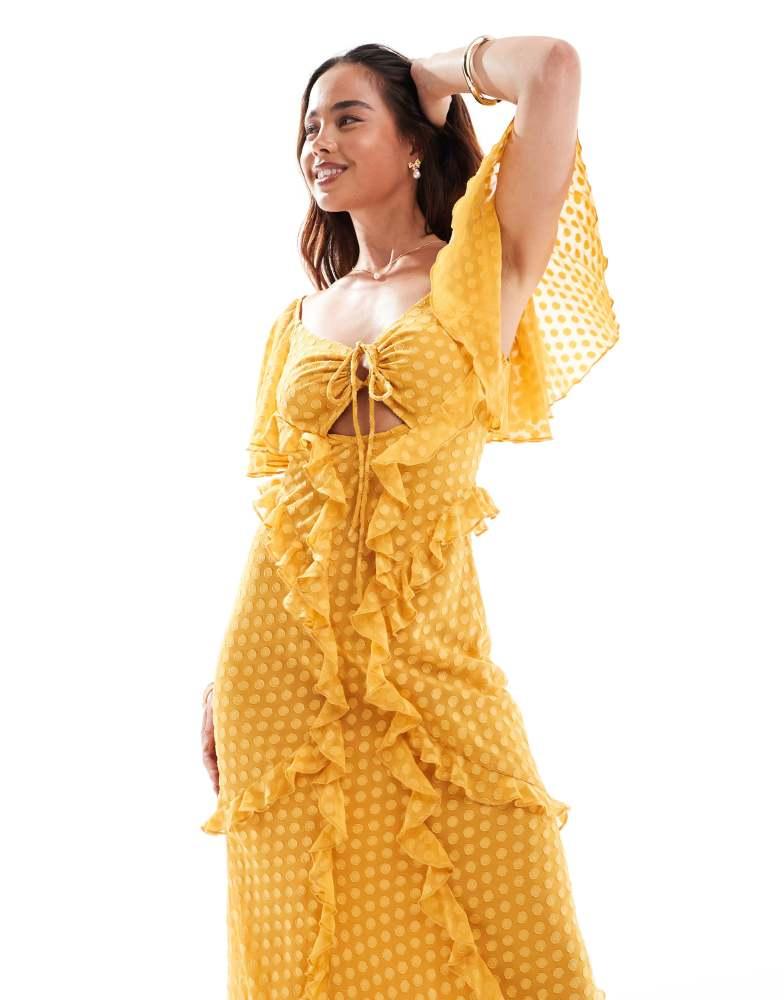 ASOS ASOS DESIGN flutter sleeve ruffle maxi dress with cut out detail in textured spot in burnt yellow