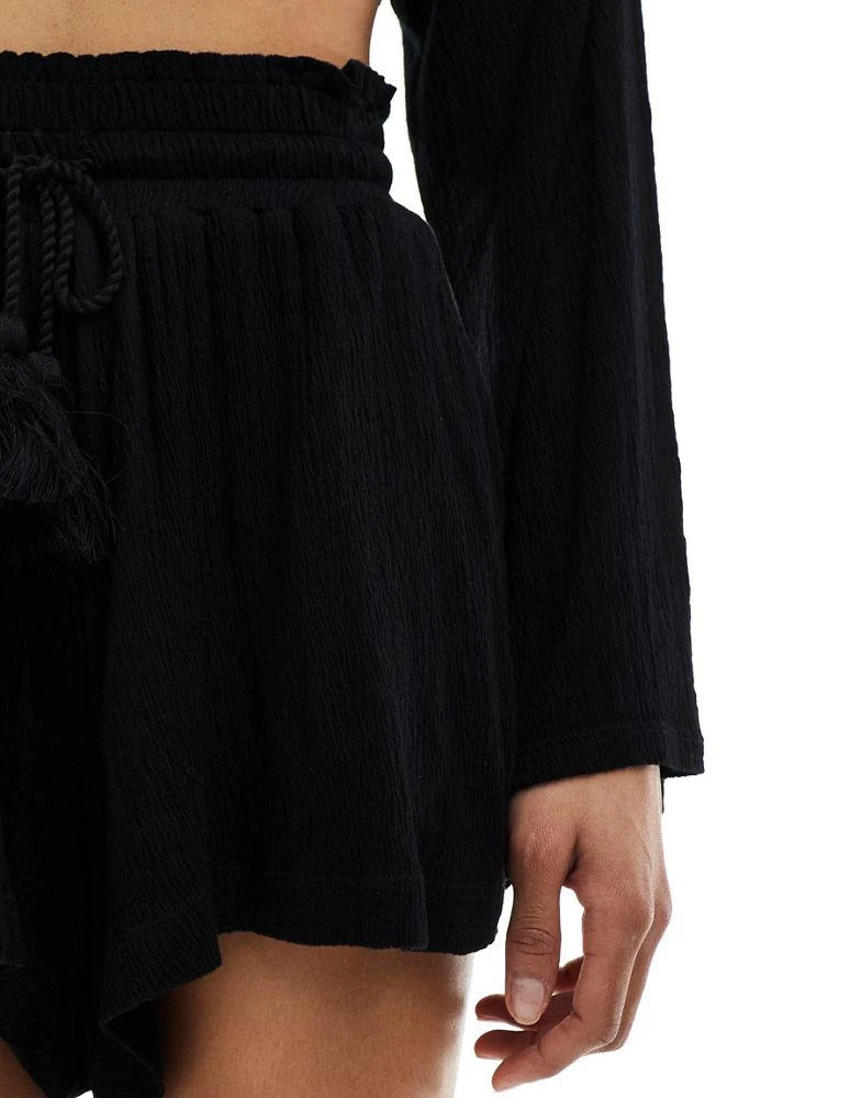 ASOS ASOS DESIGN co-ord textured tassel tie waist flippy shorts in black 3