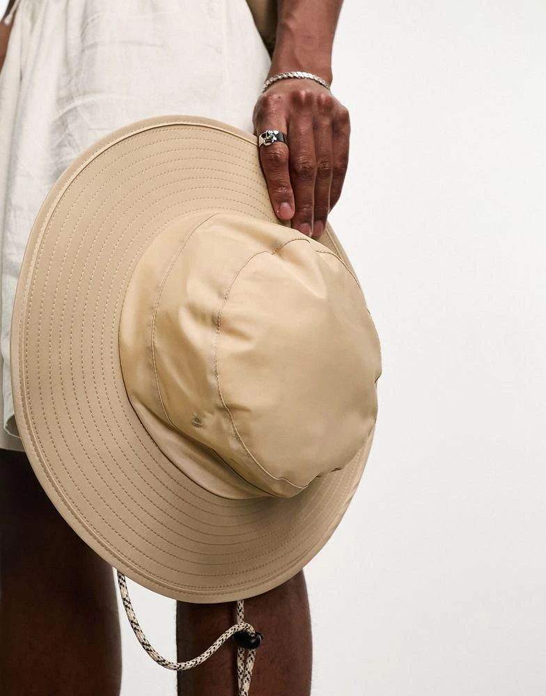 ASOS ASOS DESIGN safari bucket hat in stone nylon with contrast puller 4