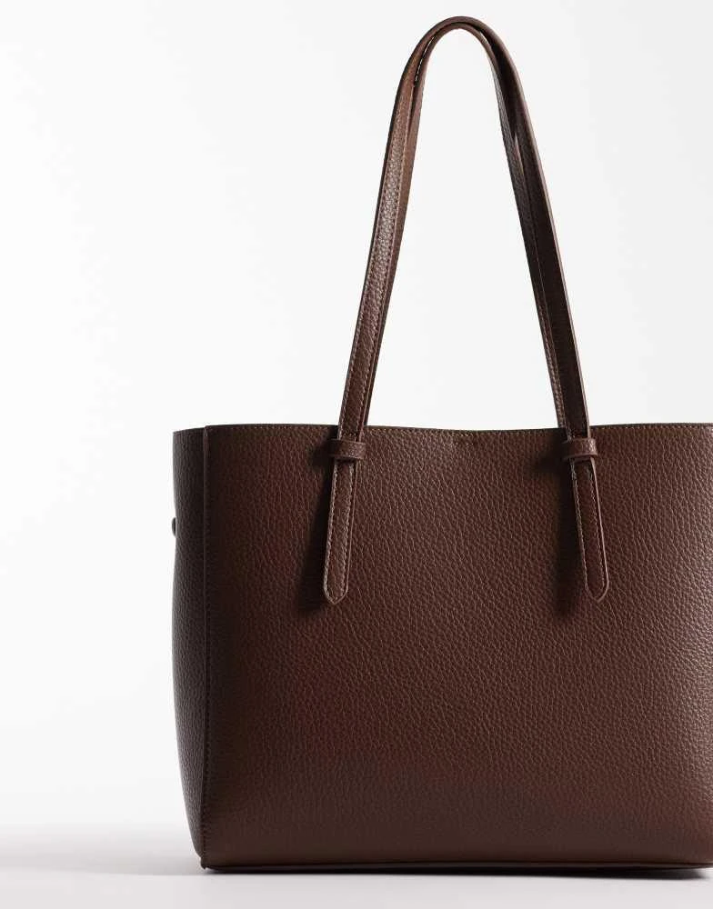ASOS ASOS DESIGN textured multi compartment tote bag with detachable bag charm in chocolate 4