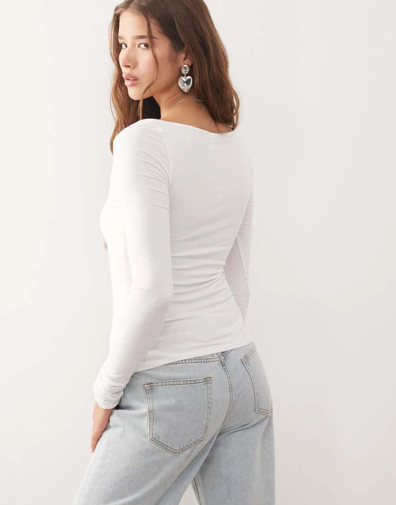 Weekday Weekday slim fit long sleeve wrap top in white 4