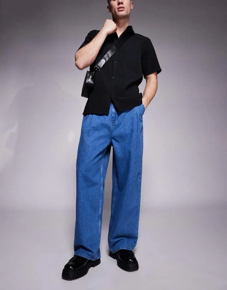 ASOS ASOS DESIGN oversized baggy jeans with side belts in mid wash blue 1