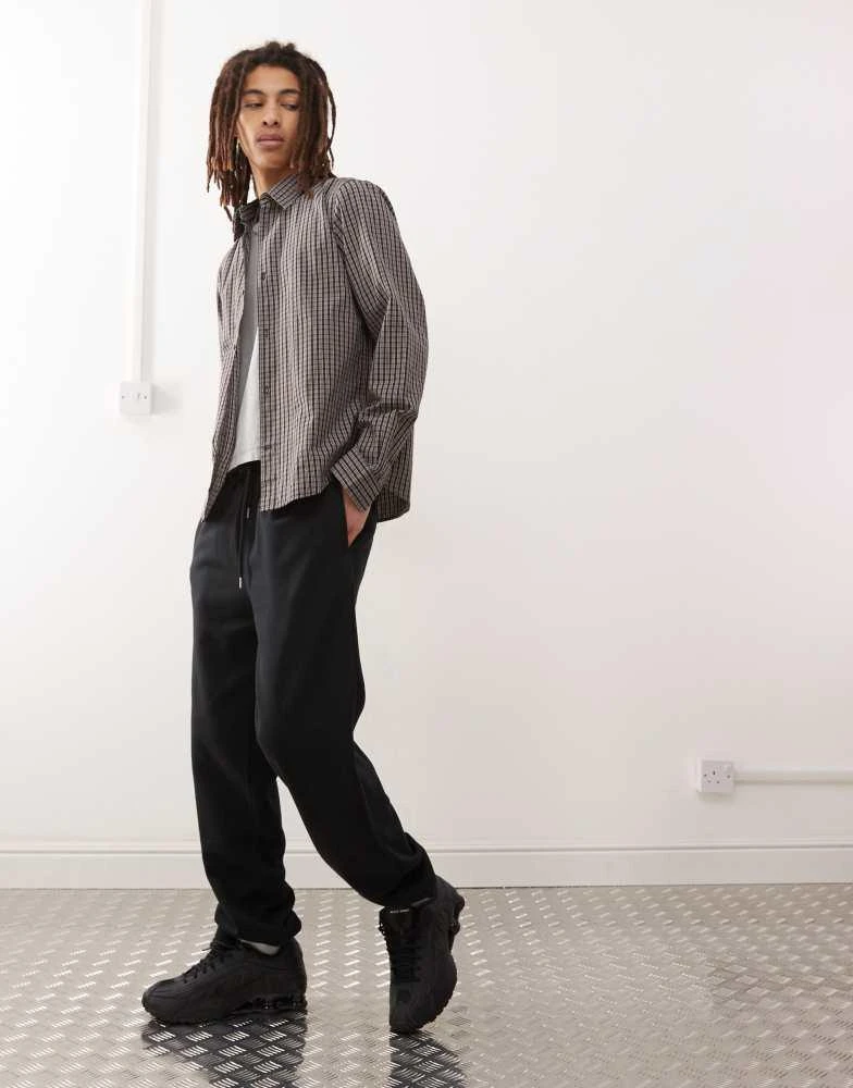 COLLUSION COLLUSION joggers in black 1