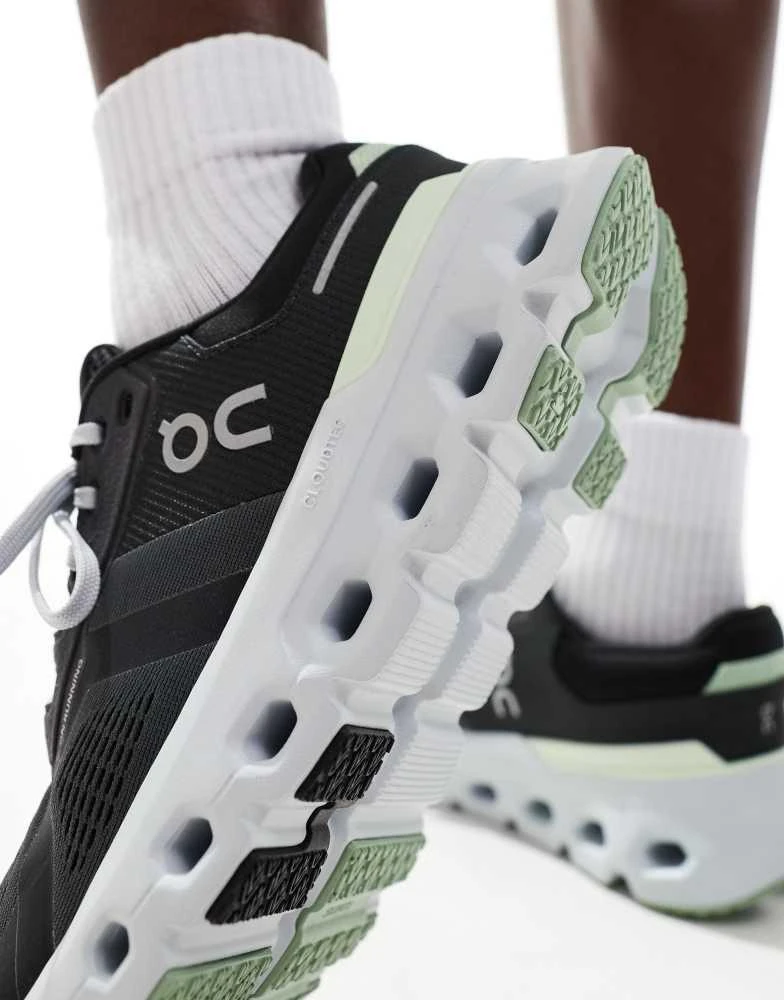 On ON Cloudrunner 2 running trainers in black and lime green 4
