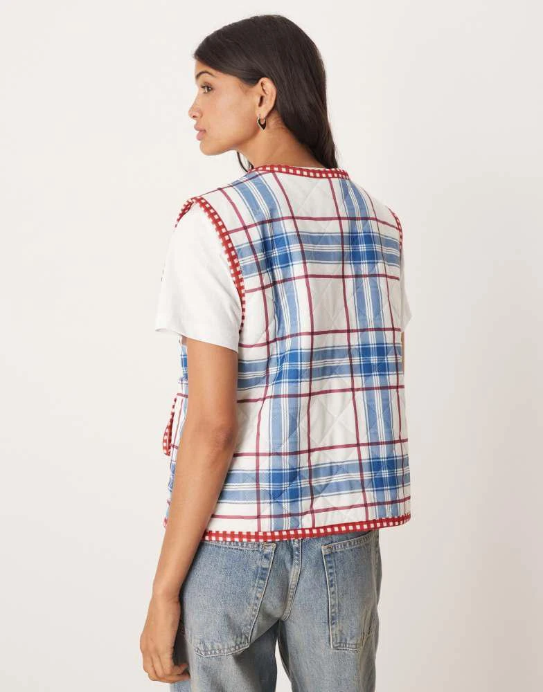 ASOS ASOS DESIGN gilet with check quilted design and bow pocket detail in blue 4