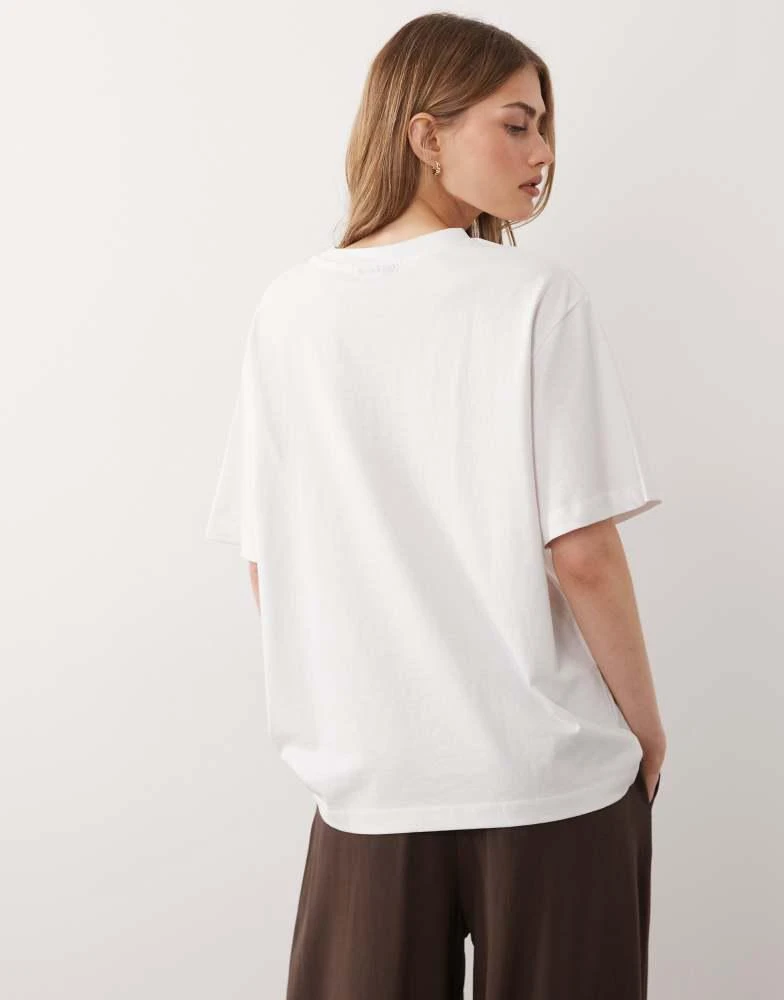 ASOS ASOS DESIGN short sleeve oversized top with oyster graphic in white 2
