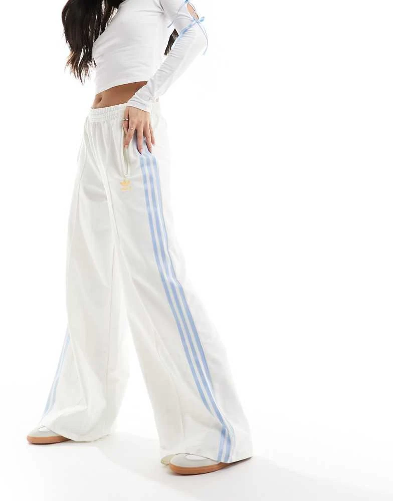 Adidas adidas Originals three stripe track pants in off white and blue 1